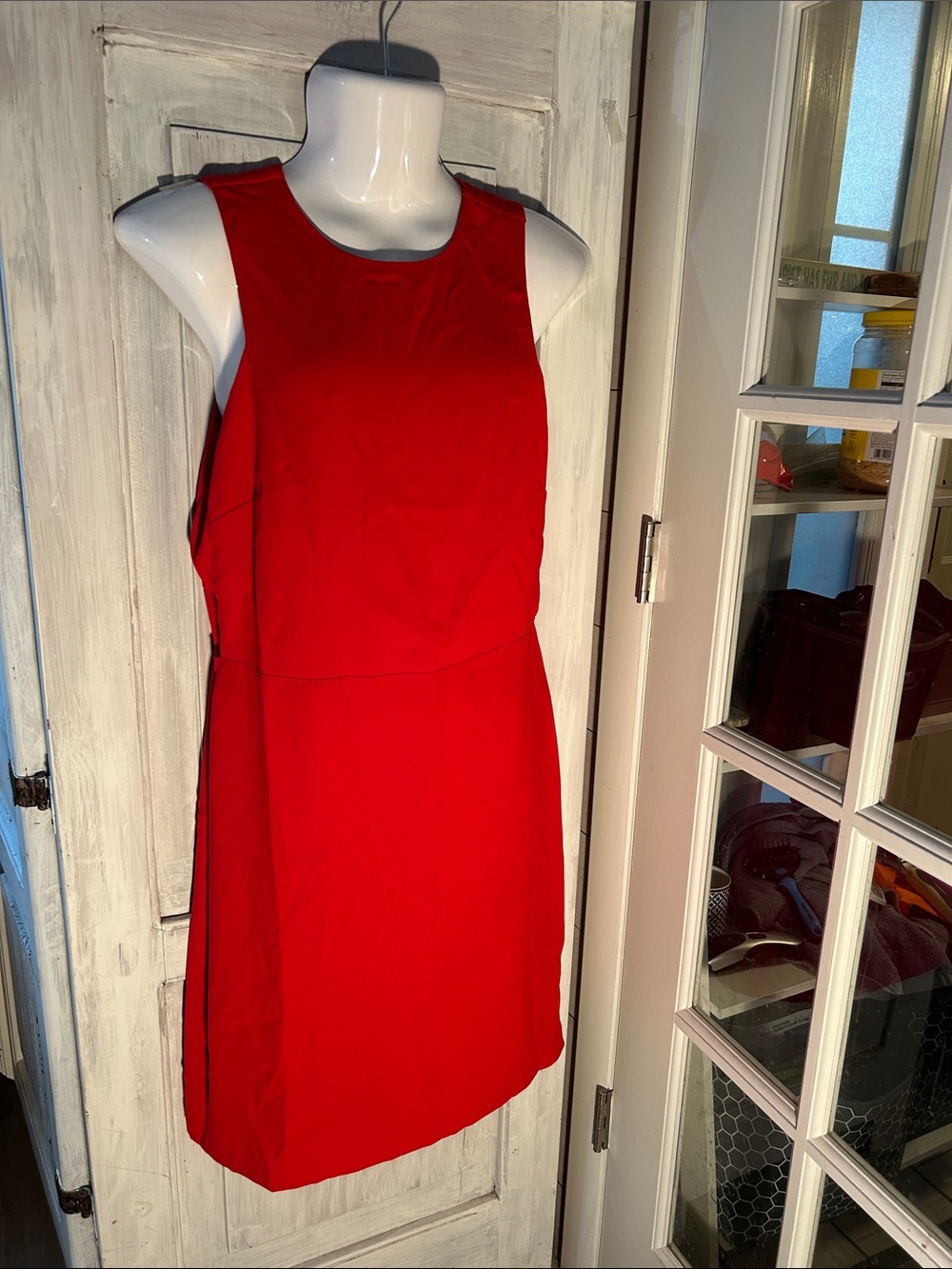 Classic Sleeveless Red Shift Dress with side cut outs and drop waist.